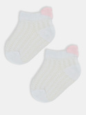 White jacquard baby socks with a pink heart