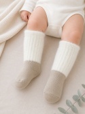 Skarpetki niemowlęce długie z puszystym ściągaczem 0-6m - beżowe
